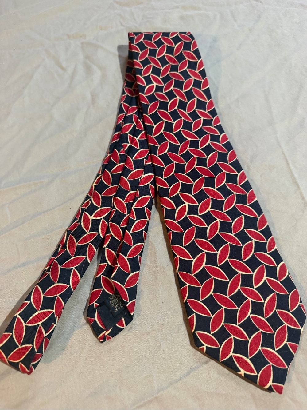 Jos. A. Bank Navy Tie with Red and Cream Geometric Pattern